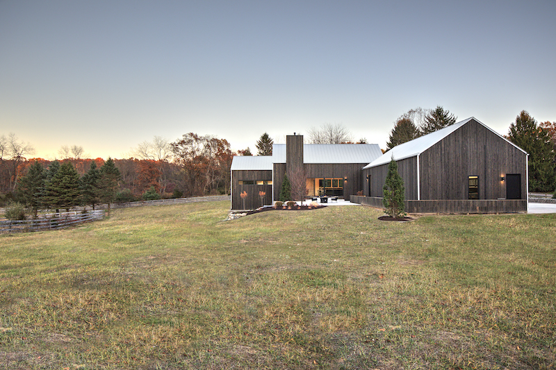 Exterior of Hilltop Farm by Hygge Custom Homes, featuring Marvin Essential windows and doors.