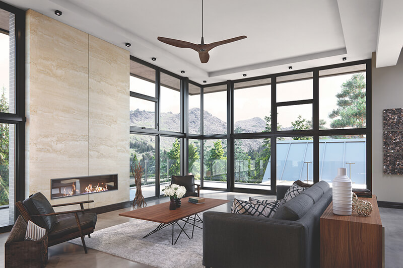 Living room with black windows and moody colored furniture