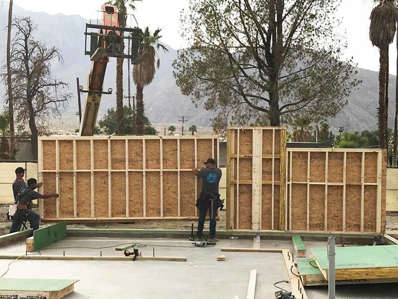 Panels of desert house being installed