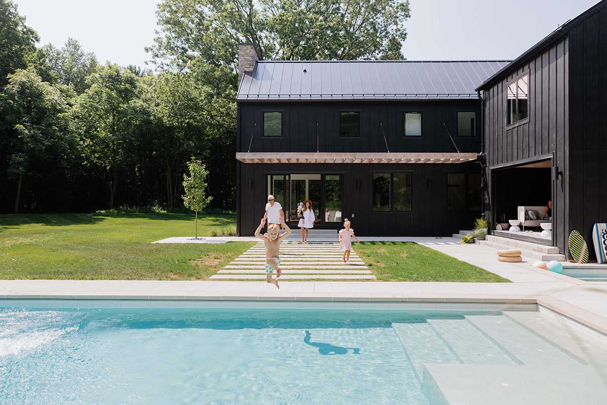 Exterior view of home with pool and Marvin Windows and Doors