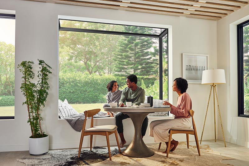 A family sitting at their kitchen table next to a Marvin Skycove.