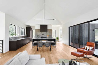 Marvin Essential Casement and Marvin Essential Direct Glaze windows in a modern farmhouse living room and kitchen. 