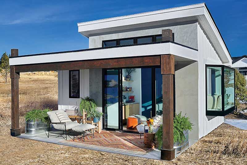 The covered patio of the House Beautiful Whole Home WeShed, featuring Marvin Skycove, Marvin Awaken and Elevate windows and doors.