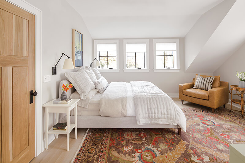 A bedroom with three Marvin casement windows.