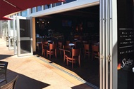 Patio with Marvin Signature Coastline Bi-fold Door