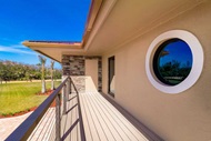 Exterior of home with Marvin Signature Coastline Polygon Window