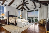 Bedroom with Marvin Signature Coastline Casement Window and Multi-Slide Door