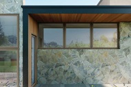 The exterior of a modern home with Marvin Essential Awning Windows