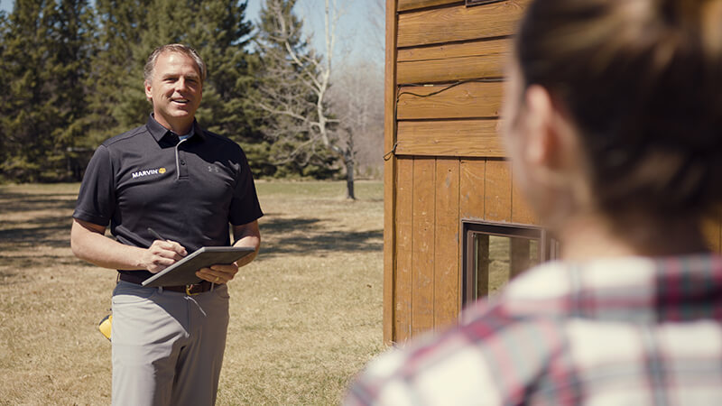 Homeowner communicating with a window and door specialist.