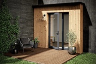 Exterior of modern style home with open Marvin Modern Outswing Door in Gunmetal Finish