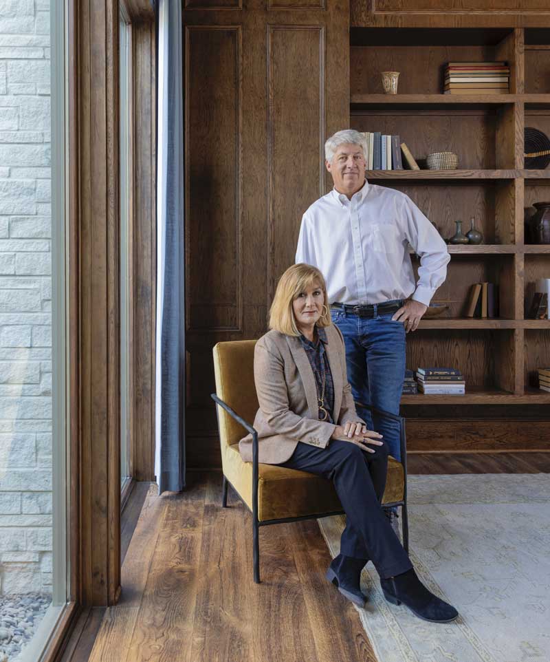 Resiential Designers, Luke Sippel and Bill Holloway of Lake + Land Studio, standing on the porch of the Southern Living Idea House 2023 in Leiper's Fork, TN.