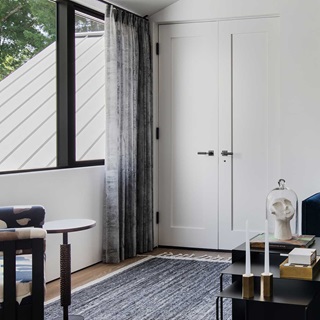 A sitting room in Stay Bungalow in Austin, Texas, featuring Marvin Modern Direct Glaze and Marvin Modern Casement windows.