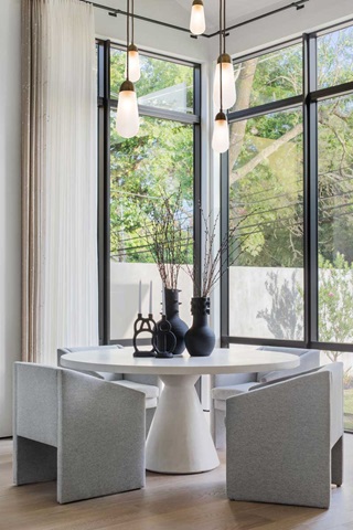 Dining room with modern table and chairs and modern direct glaze windows
