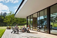 Group of people on a deck with Marvin Signature Modern Multi-Slide Door