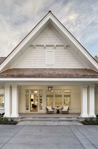 The front porch of a traditional home featuring Marvin Ultimate Double Hung windows.