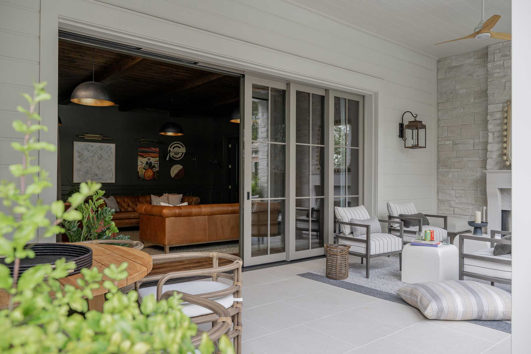 Looking into the lower level of the Southern Living Idea House 2023 from the pool patio, through a Marvin Ultimate Multi-Slide door.