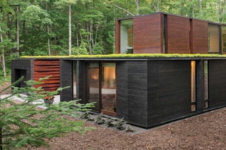 Exterior of home with Marvin Signature Ultimate Casement windows, sliding patio door and lift and slide door