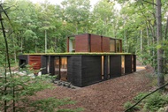 Exterior of home with Marvin Signature Ultimate Casement window, Sliding Patio Door and Lift and Slide Door