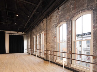 Interior of historic building with Marvin Ultimate Double Hung Round Top Magnum Windows