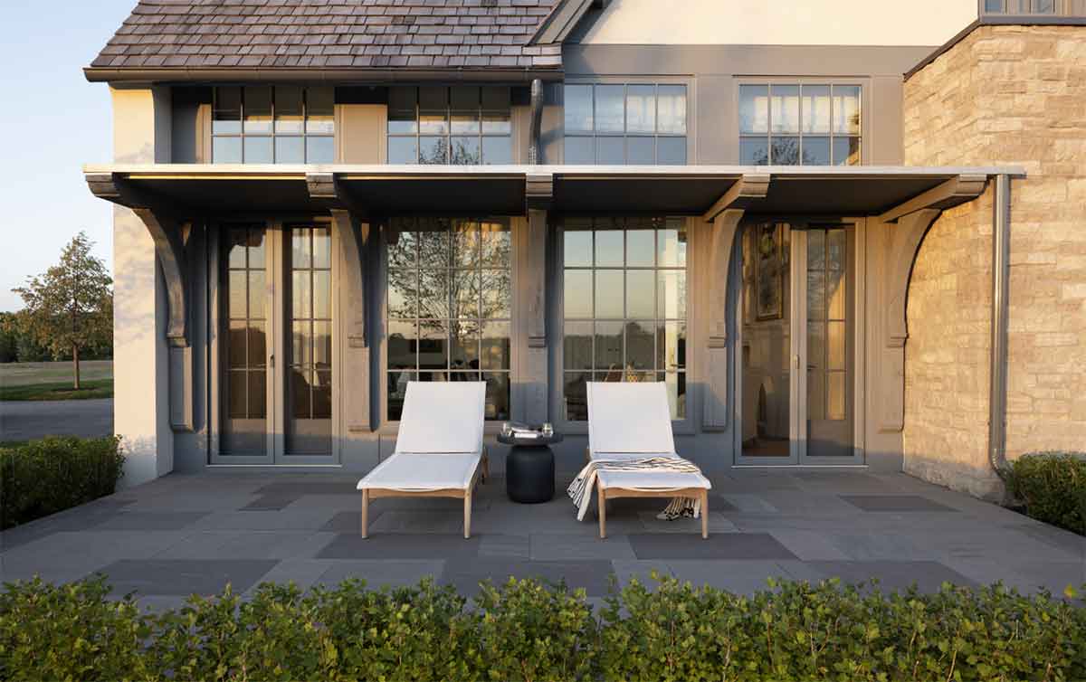 The patio of a Swedish traditional home in Medina, Minnesota, featuring Marvin Ultimate windows and doors.