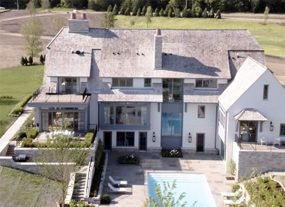 The exterior of a Swedish traditional home in Medina, Minnesota, featuring Marvin Ultimate windows and doors and a pool.