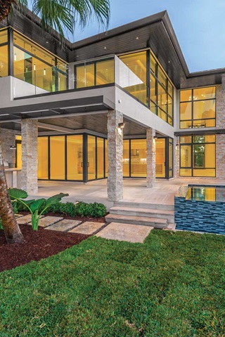 Exterior of home with Marvin Signature Coastline Casement Awning Direct Glaze Windows and Marvin Signature Coastline Multi-Slide Door