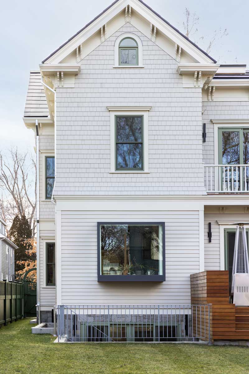 The back of an Italianate home in Cambridge, Mass., with a Marvin Skycove, Marvin Ultimate Double-Hung G2 windows, and an Ultimate round-top window.