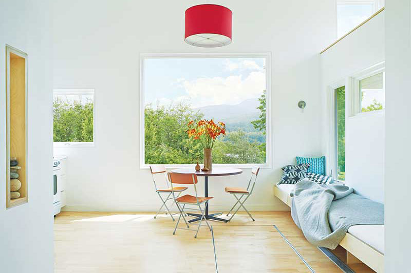 Marvin Ultimate Picture window and Marvin Ultimate Awning window with a view of the countryside.