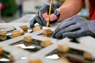 Man Working On Details Of Marvin Window