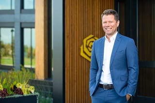 Paul Marvin, CEO and Chair of the Board in front of Marvin Headquarters