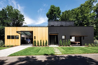 Modern industrial-style home in Orono, MN featuring Marvin Ultimate Awning windows and unique garage door design and placement.