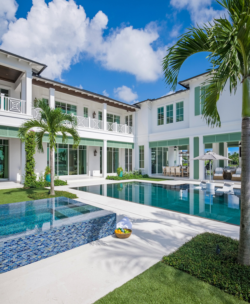 The exterior of a home in Jupiter, Florida, featuring Marvin Coastline Multi Slide Door, Coastline Picture Windows and a Coastline Outswing French Door.