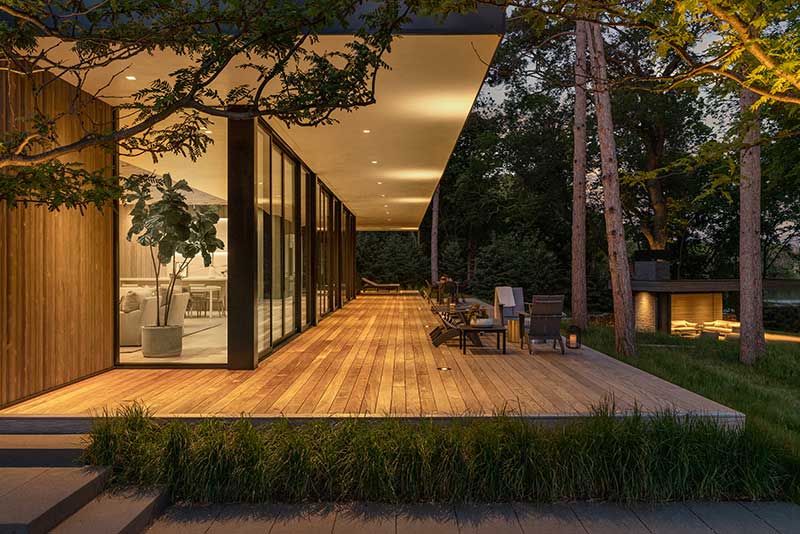 A modern home on Lake Minnetonka at night with Marvin Modern Multi Slide Doors and Marvin Modern Direct Glaze windows.