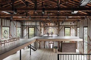 The second-floor mezzanine of The Church in Sag Harbor, New York, a former Methodist church converted into a center for the arts, featuring custom Marvin Ultimate windows with divided lights.
