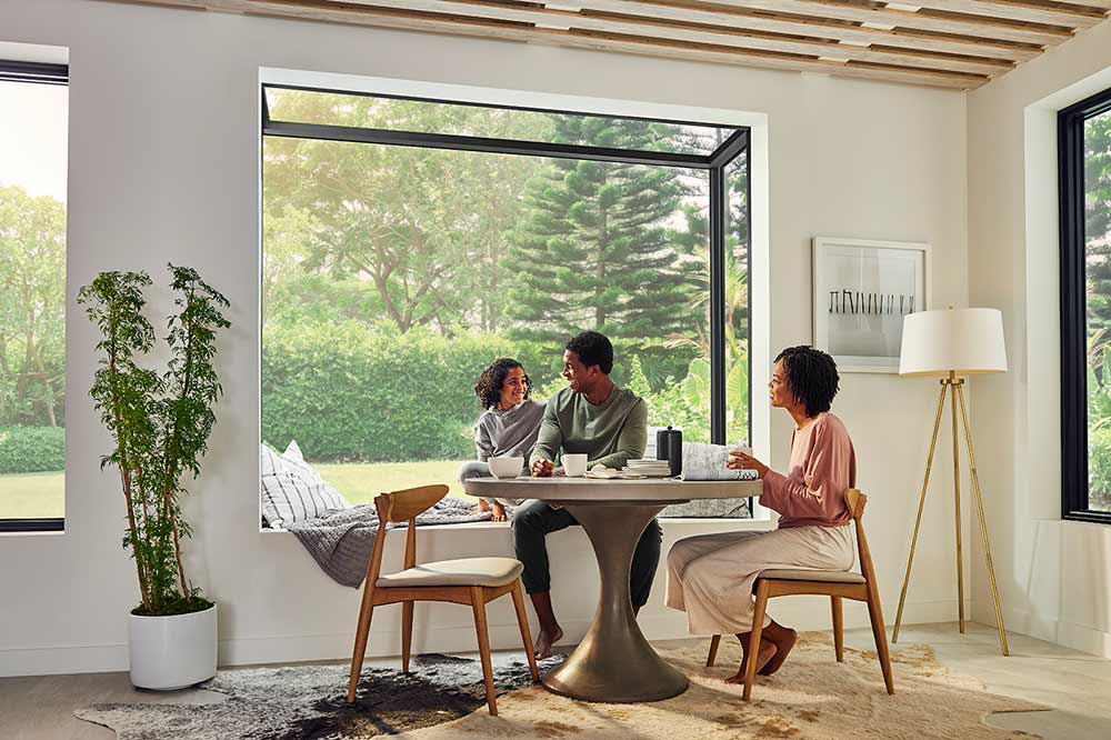 A family sitting at their kitchen table next to a Marvin Skycove.