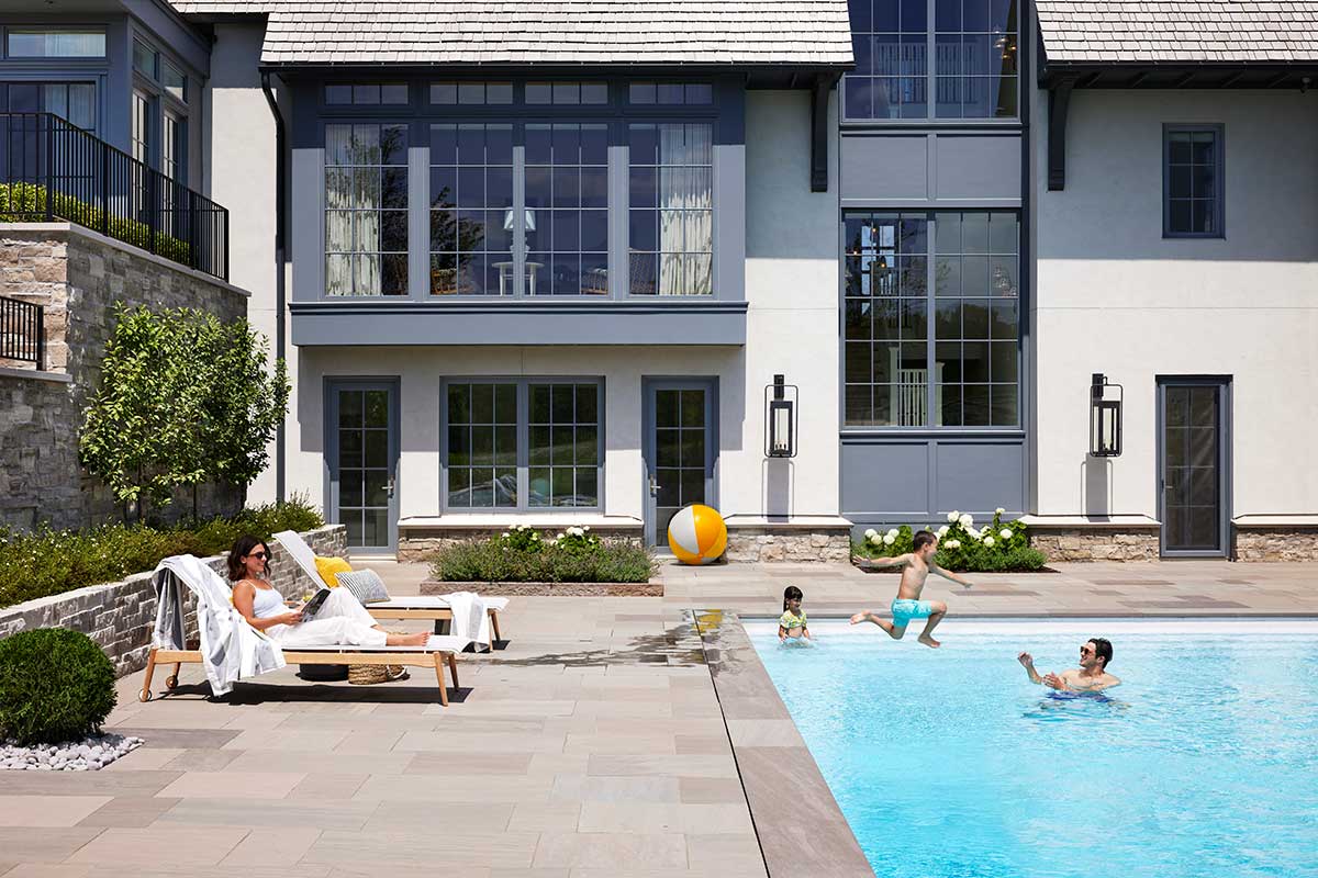 Exterior view of home with pool and Marvin Windows and Doors